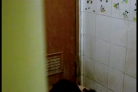 Young girl in a tights takes a shower.